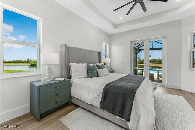 Bedroom featuring access to outside, french doors, light wood-style floors, ceiling fan, and recessed lighting | Image 10