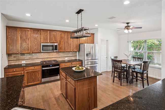 Spacious kitchen with lots of lighting, gas stove, walk in pantry | Image 14