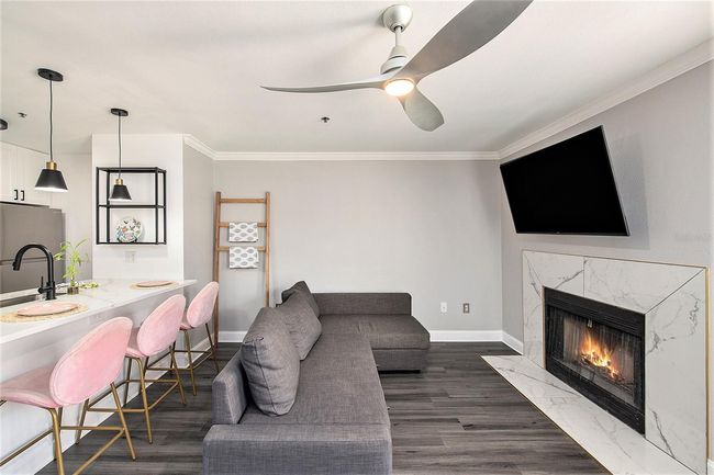 View of Living area and breakfast bar, fire place | Image 6