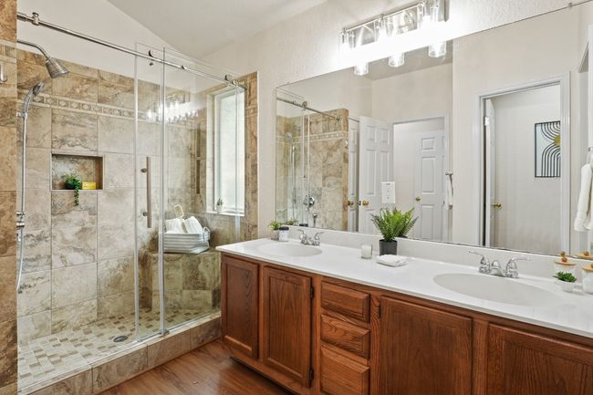 Dual vanity offers plenty of space for everyday routines. 9349 Bernoulli Dr., Austin, TX 78748 | Image 18