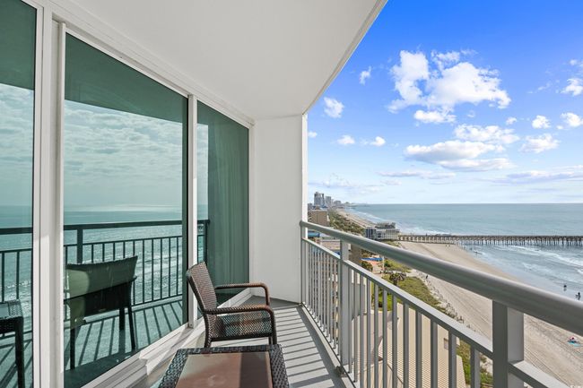 Balcony with a view of the beach and a water view | Image 26