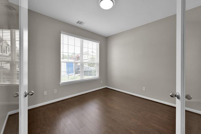 Office with french doors. Looking from the outside looking in. New wood flooring. | Image 7