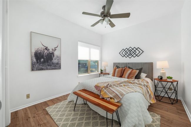 Bedroom featuring wood finished floors and a ceiling fan | Image 18