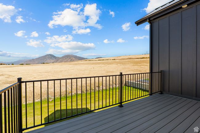 Wooden deck with a lawn, a view of countryside, and a mountain view | Image 32