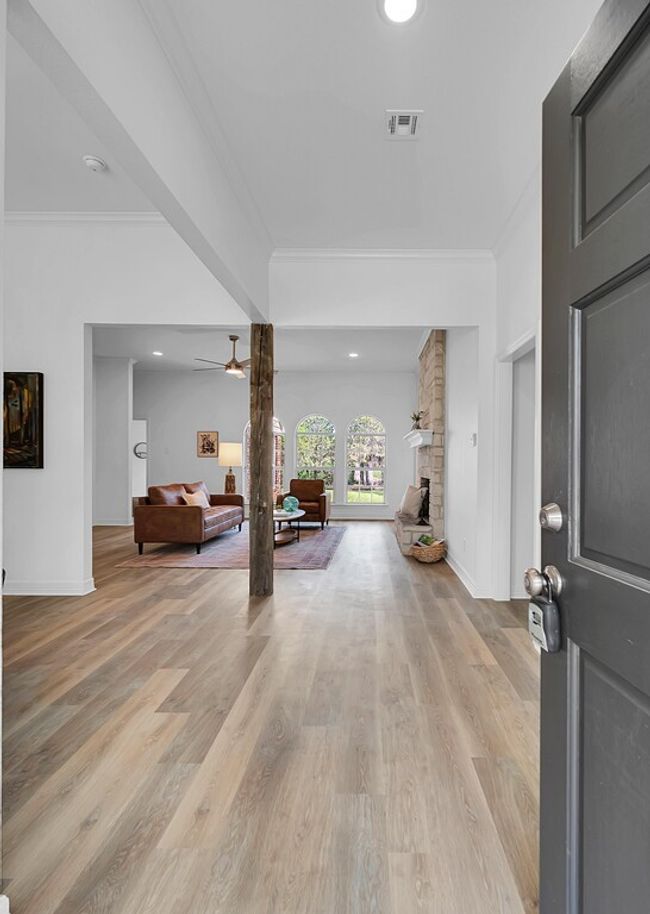 Entry with light wood-style flooring, and reclaimed, vintage timber beam column | Image 5
