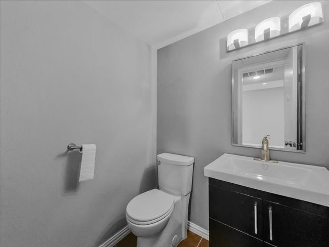 Bathroom featuring vanity and toilet | Image 26