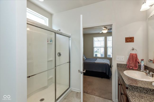 ensuite bathroom with vanity and a shower stall | Image 16