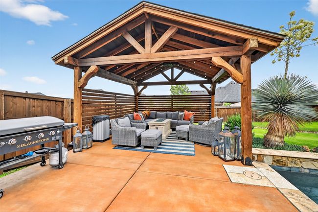 Fenced backyard with a gazebo, outdoor lounge area, a patio area, and area for grilling | Image 39