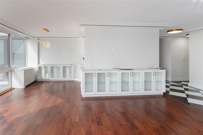 Empty room with wood finished floors and baseboards | Image 9