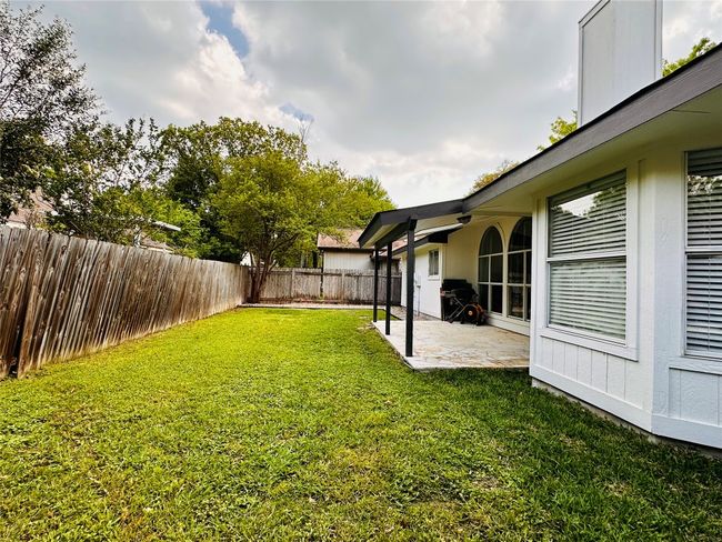 View of yard with a patio area and a fenced backyard | Image 23