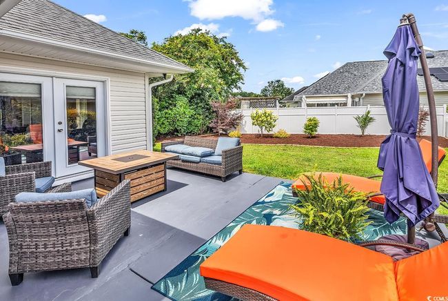 View of patio / terrace with an outdoor living space with a fire pit and french doors | Image 15