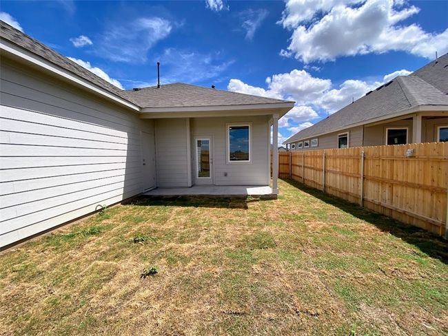 back yard looking at house with porch | Image 16
