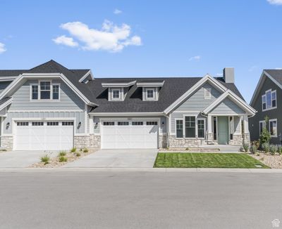 Craftsman-style home featuring a garage | Image 1