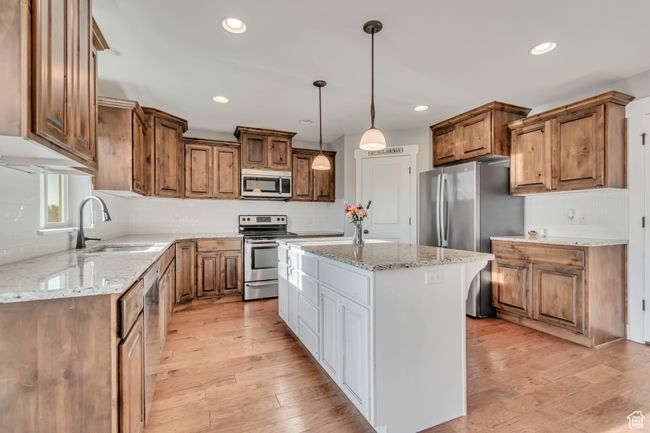 Kitchen with stainless steel appliances, granite counter tops, hardwood floors. | Image 6