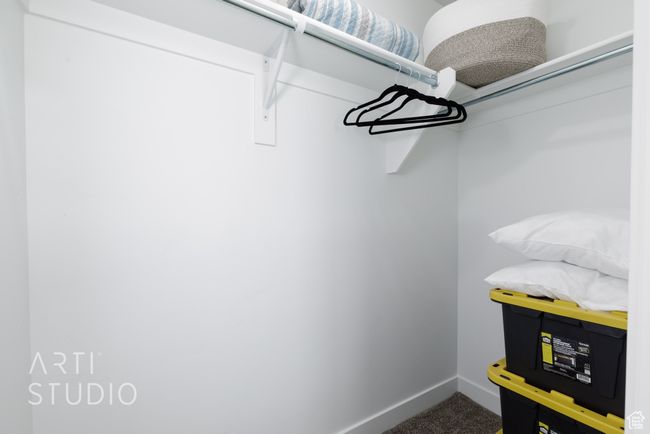 Walk in closet with carpet flooring | Image 28