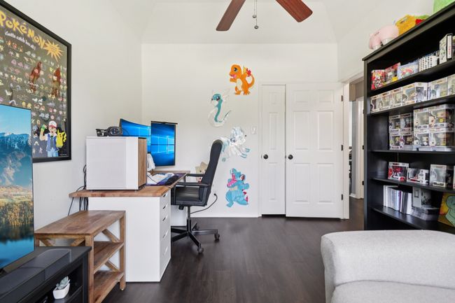 Office with wood finished floors, a ceiling fan, and baseboards | Image 26