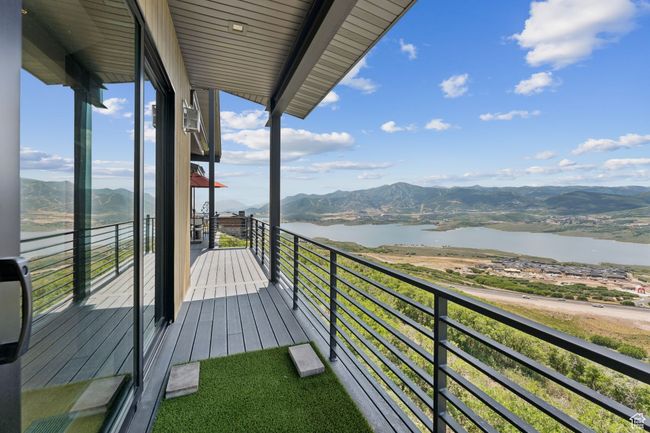 Balcony featuring a water and mountain view | Image 50