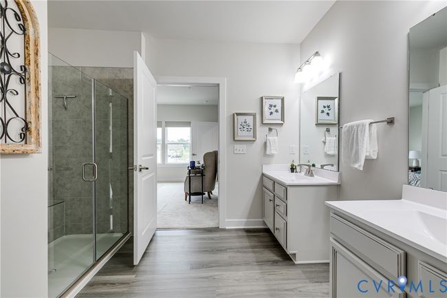 Featuring the walk-in shower with built-in bench | Image 16