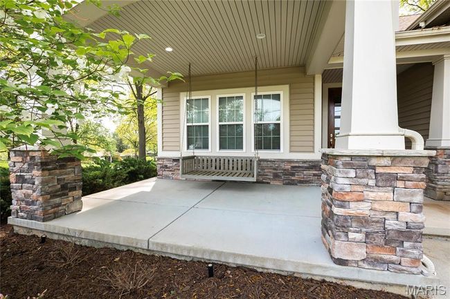 View of patio / terrace featuring a porch and front swing | Image 4