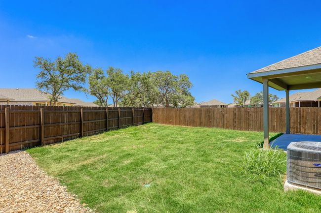 View of fenced backyard | Image 24