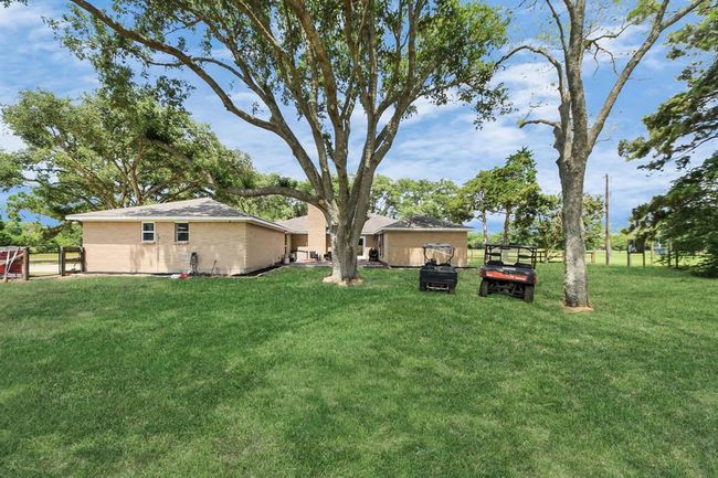 Enjoy nearly an acre of fenced backyard—ideal for kids, pets, or outdoor fun. | Image 31
