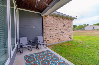 Doorway to outside featuring ornamental molding and hardwood / wood-style flooring | Image 3