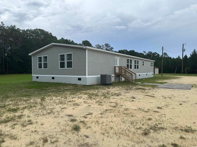 Back of house with crawl space | Image 5
