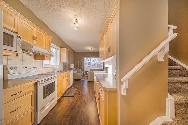 84 Bridleridge Manor Sw, Home with 3 bedrooms, 2 bathrooms and 1 parking in Calgary AB | Image 9
