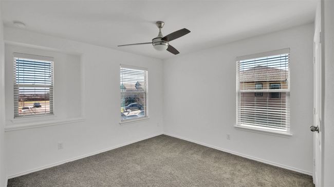 Carpeted spare room with ceiling fan and baseboards | Image 30