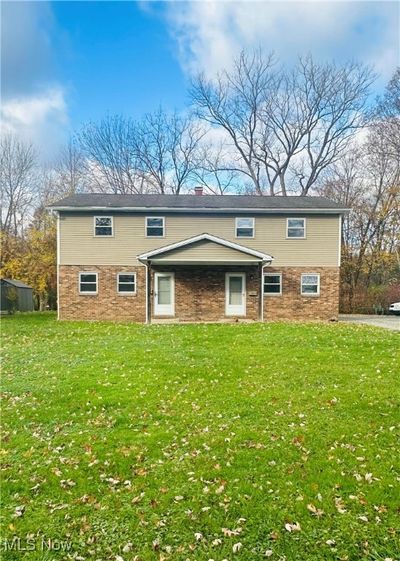 View of front of property featuring a front yard | Image 1