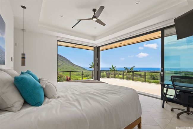 Multi-slide doors open here in the Primary Bedroom, continuing the indoor-outdoor experience. | Image 9