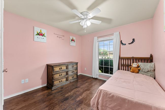 1st floor Bedroom featuring wood finished floors and ceiling fan | Image 20
