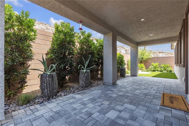 Fenced backyard featuring a patio area | Image 29