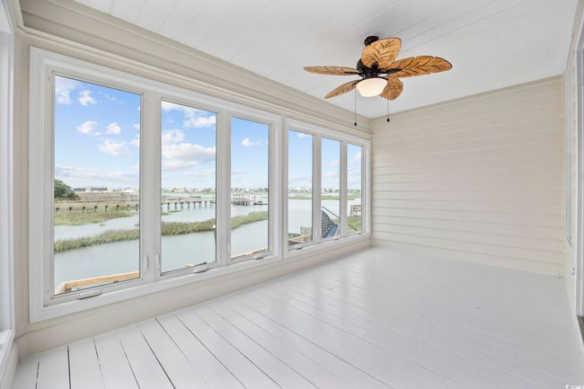Unfurnished sunroom featuring a water view and healthy amount of natural light | Image 13