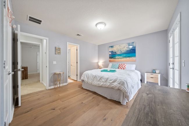 Bedroom featuring light wood-style flooring and french doors | Image 19