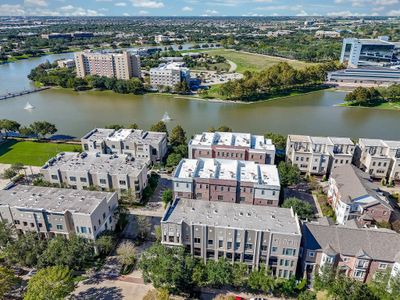 Experience the unique blend of luxury and convenience at Lake Pointe, Sugar Land's premier LIVE/WORK community. Steps from Whole Foods, upscale dining, and local services, these elegant townhomes offer a scenic lakeside lifestyle where everything you need is a leisurely stroll away. Embrace the ease of lakeside living at Brooks Lake—your new home awaits. | Image 1