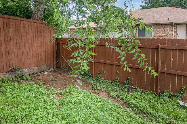 View of fenced backyard | Image 27