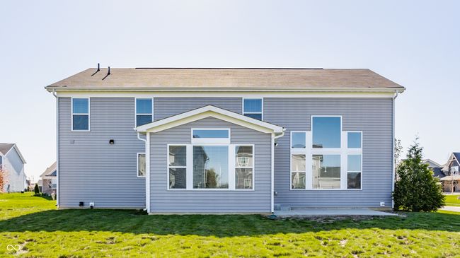 rear view of house with a yard and a patio | Image 46