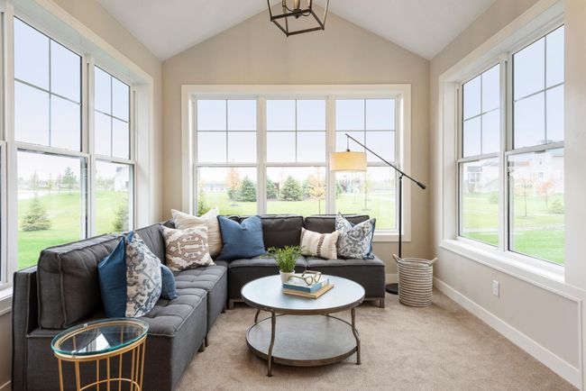 Vaulted sun-filled 4-season porch with Patio door to concrete patio (not shown). Robert Thomas Homes Villa Photos may not depict actual home plan configuration. Features/materials/finishes shown contain options that are not included in price. | Image 5
