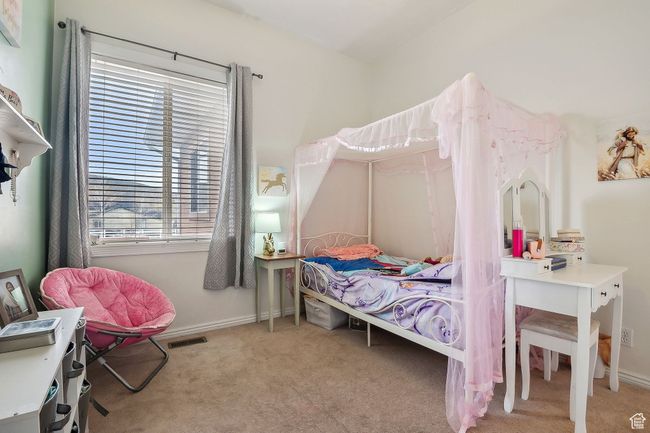 Bedroom featuring baseboards and carpet | Image 26