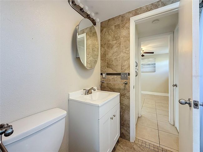 Full Bath and view into Secondary Bedroom | Image 16