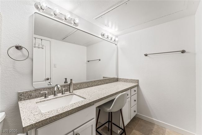 Bathroom with toilet, vanity, and baseboards | Image 19