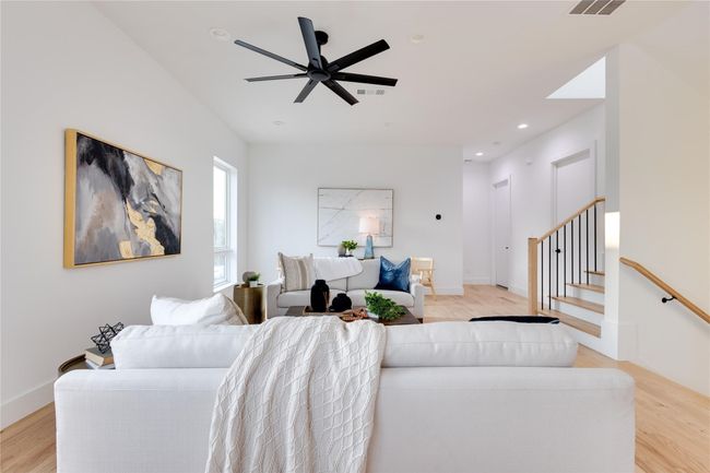 Living room featuring light hardwood / wood-style flooring and ceiling fan | Image 19