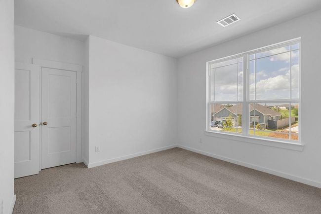 The secondary bedrooms are generously proportioned to accommodate even the large furniture you've been eyeing. | Image 20