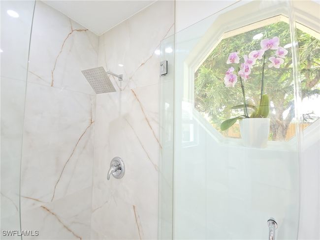 Full bathroom featuring a marble finish shower | Image 22
