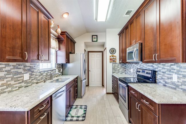 Light and bright kitchen with ample countertop space | Image 12