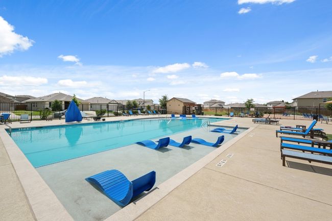 Community pool with a residential view and a patio | Image 38