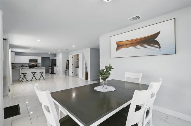 Dining area featuring recessed lighting, baseboards, and light marble finish flooring | Image 10
