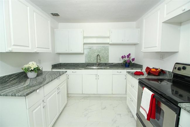 New granite counters in Kitchen. | Image 9