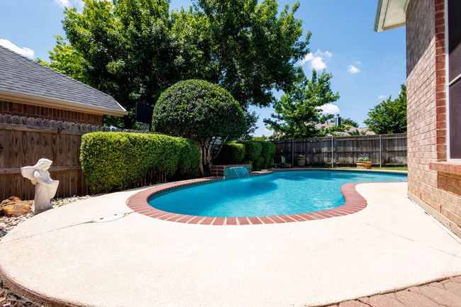 View of pool featuring a patio and a fenced backyard | Image 12